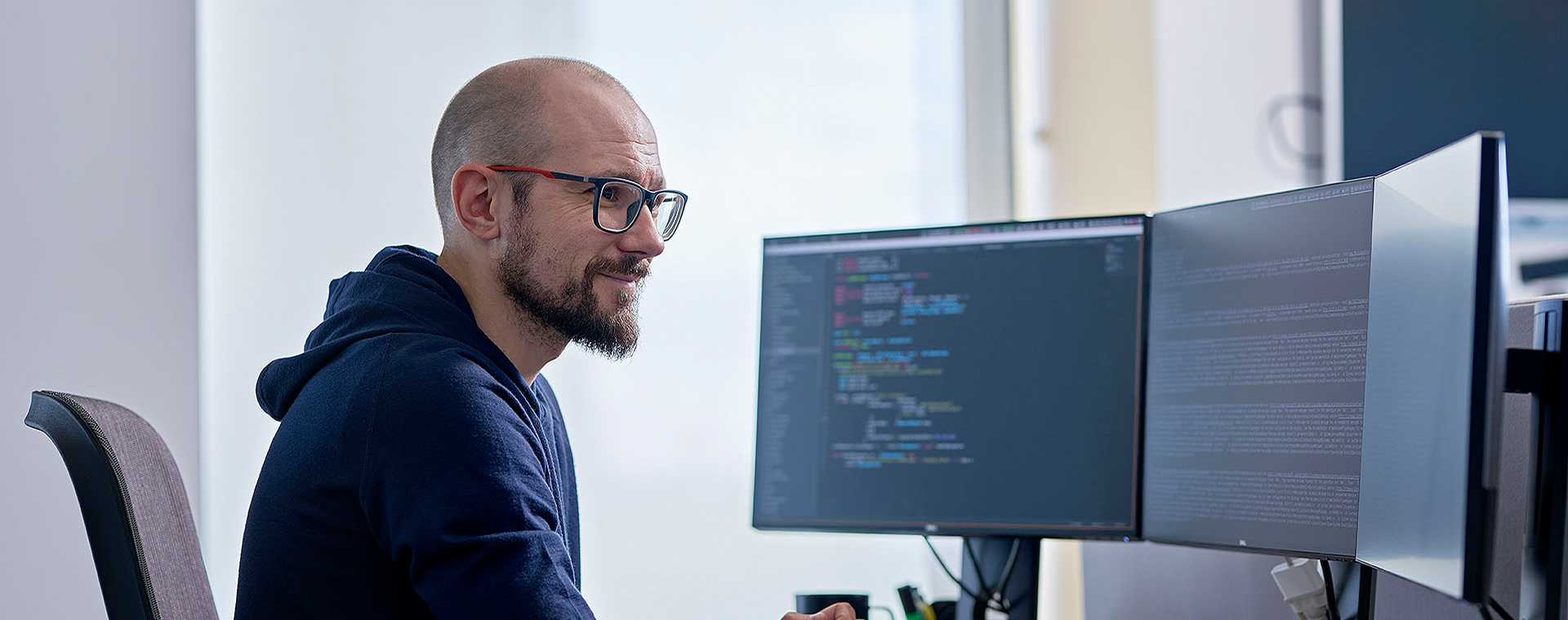 A person working at a desktop computer.