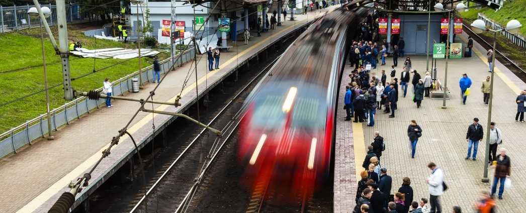 People on a platform at a train station.